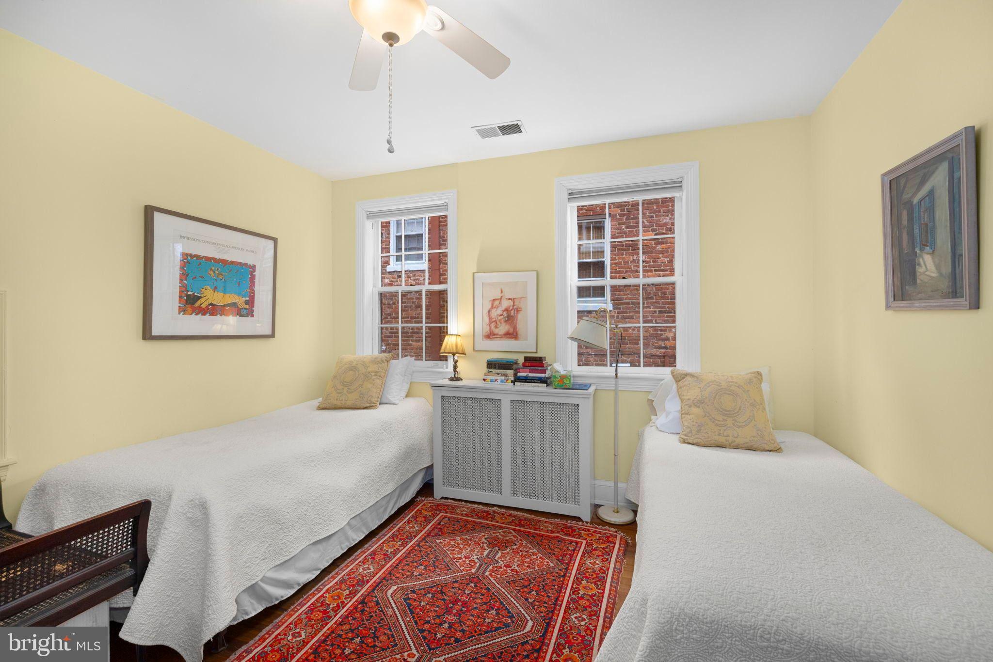 1554 34th Street Northwest Washington, DC 20007 - Photo 8 of 15 a bedroom with a bed and a window