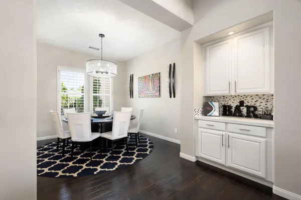a view of a dining room with furniture window and outside view