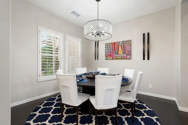 a view of a patio with furniture and table