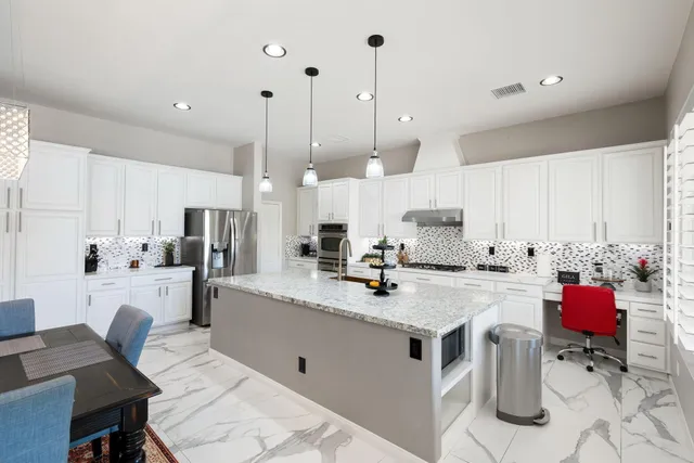 a view of a swimming pool with a patio