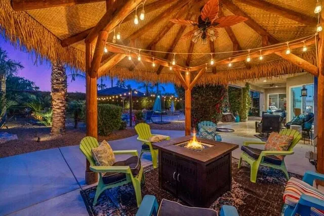 a view of a chairs and table in the patio