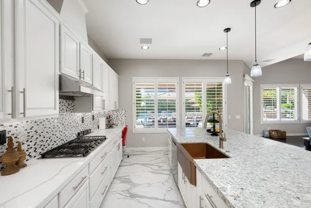 a view of a storage and utility room with wooden floor