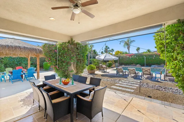 a bedroom with a bed couch and a window