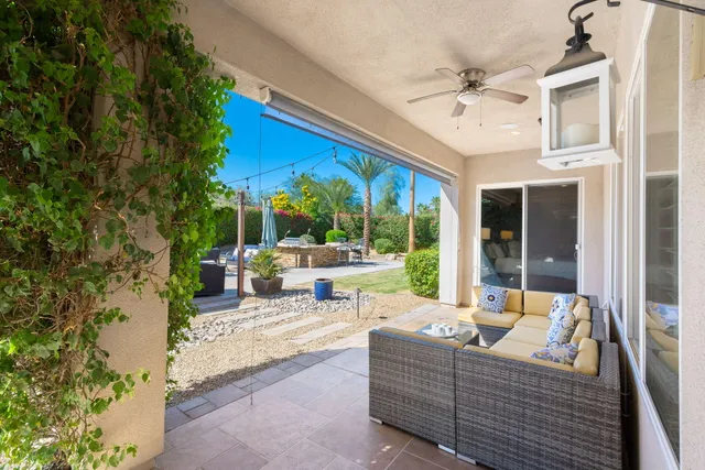 a bathroom with a double vanity sink a large mirror and shower
