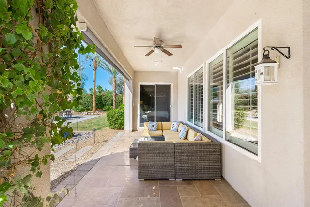 a view of a room with wooden floor and windows