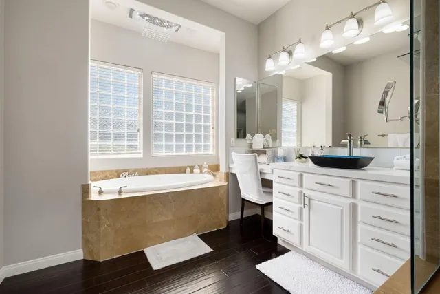 a view of a patio with a table and chairs under an umbrella
