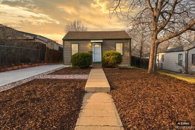 a view of a brick house with a yard