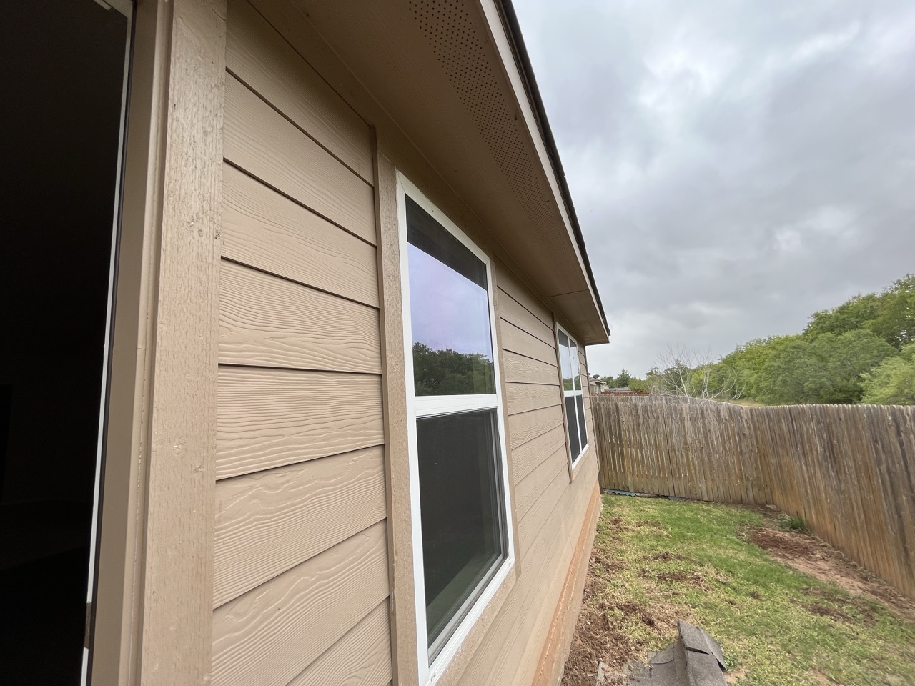 3510 Wickham Lane Austin, TX 78725 - Photo 15 of 16 View of property exterior featuring a fenced backyard