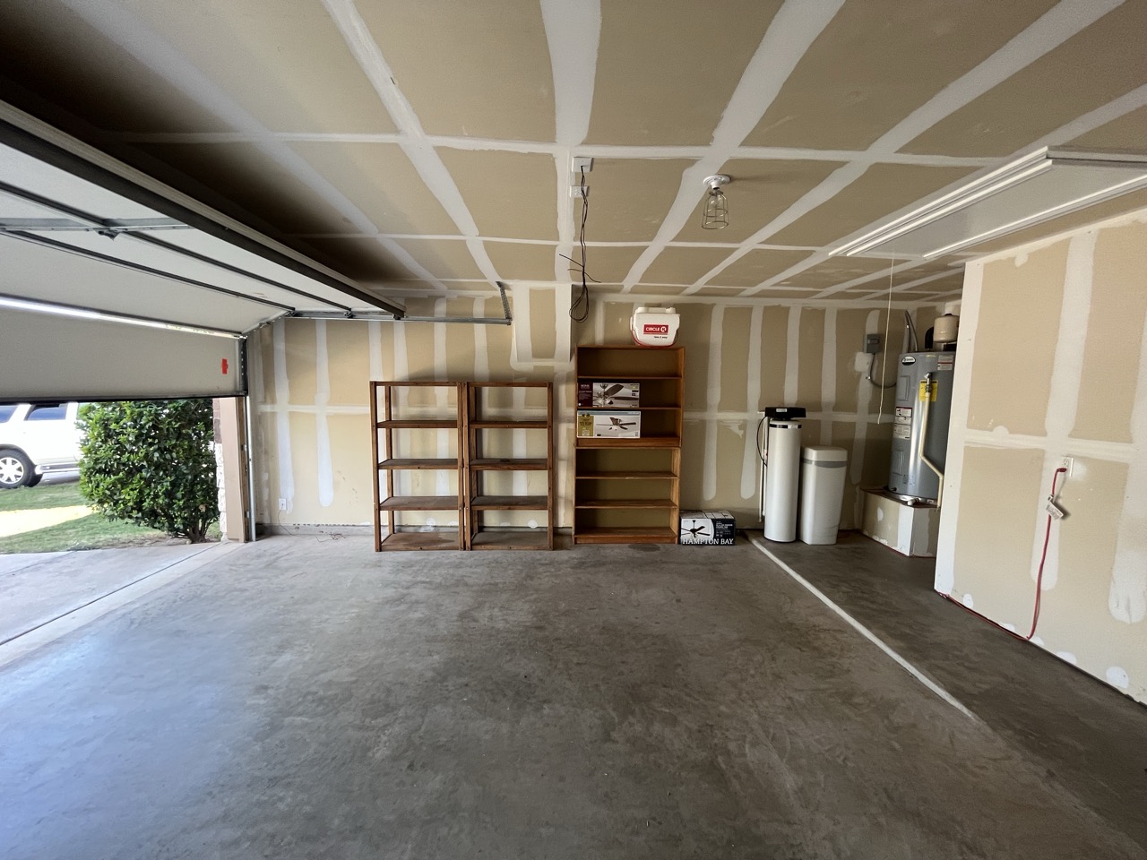 3510 Wickham Lane Austin, TX 78725 - Photo 8 of 16 Garage with electric water heater