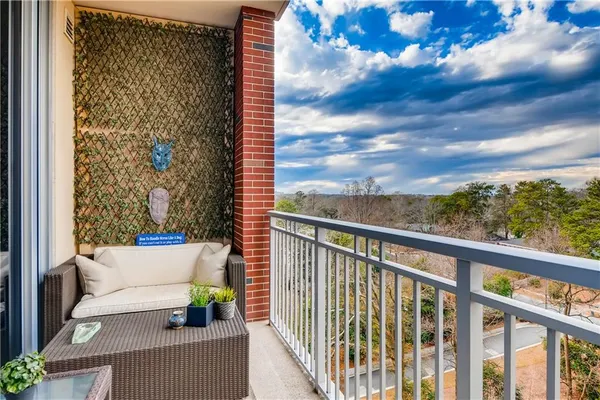 a view of balcony with furniture