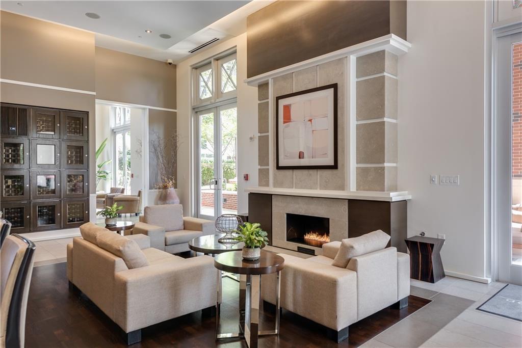 1820 Peachtree Road Northwest, Unit 811 Atlanta, GA 30309 - Photo 31 of 42 a living room with furniture and a fireplace