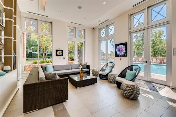 a living room with furniture and a large window