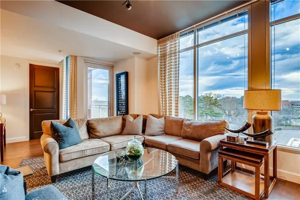 a living room with furniture and a large window