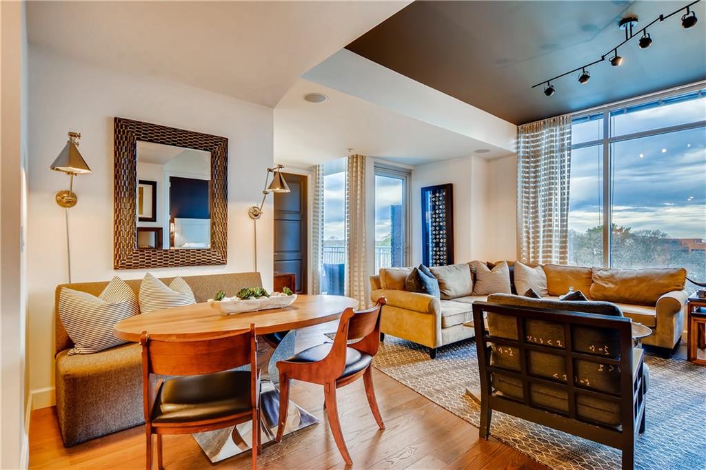 1820 Peachtree Road Northwest, Unit 811 Atlanta, GA 30309 - Photo 7 of 42 a living room with furniture and floor to ceiling windows