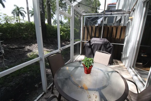 a view of balcony with furniture