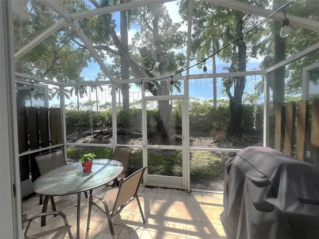 a view of a patio with a yard