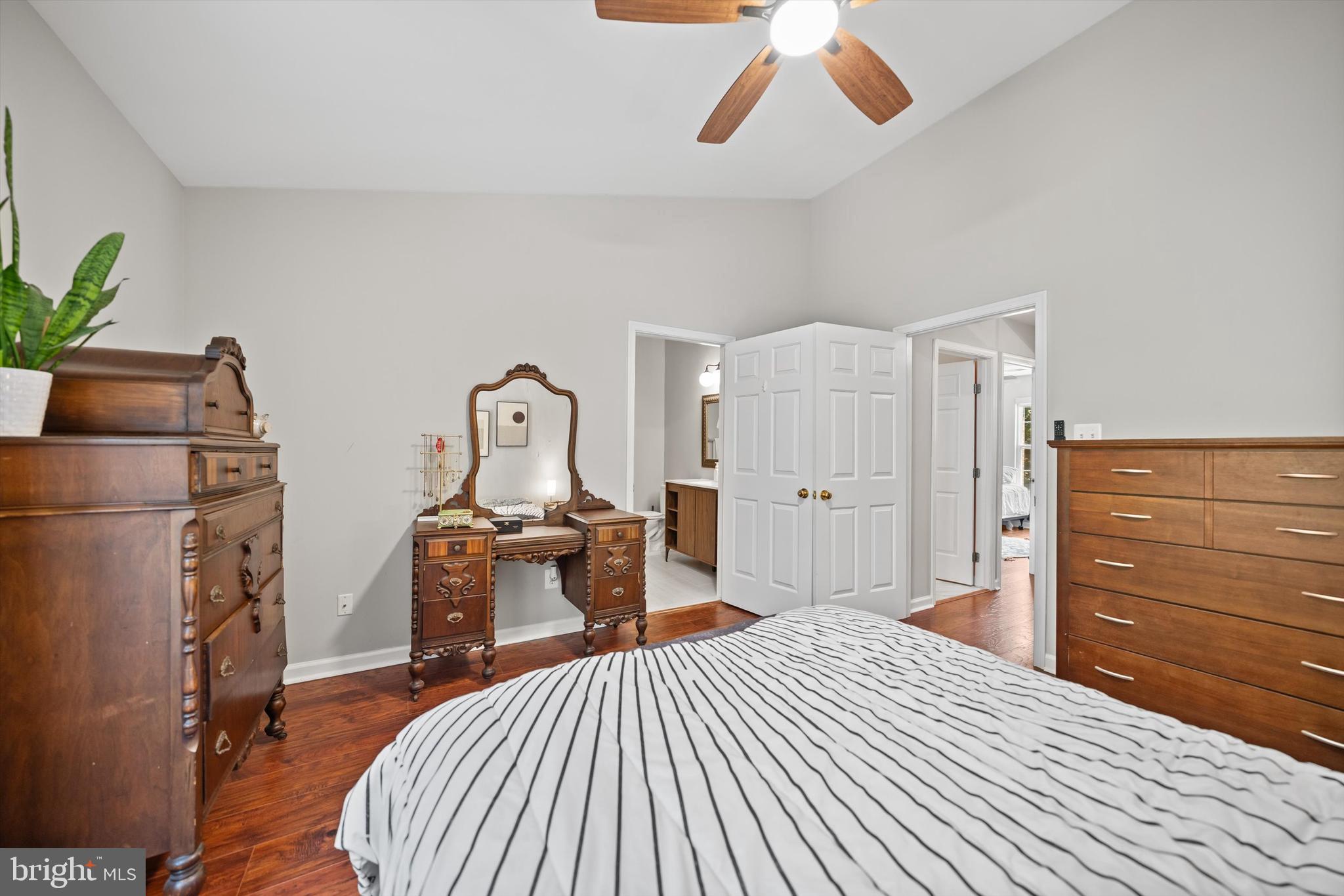 12794 Silvia Loop Woodbridge, VA 22192 - Photo 14 of 24 a bedroom with a bed and wooden floor