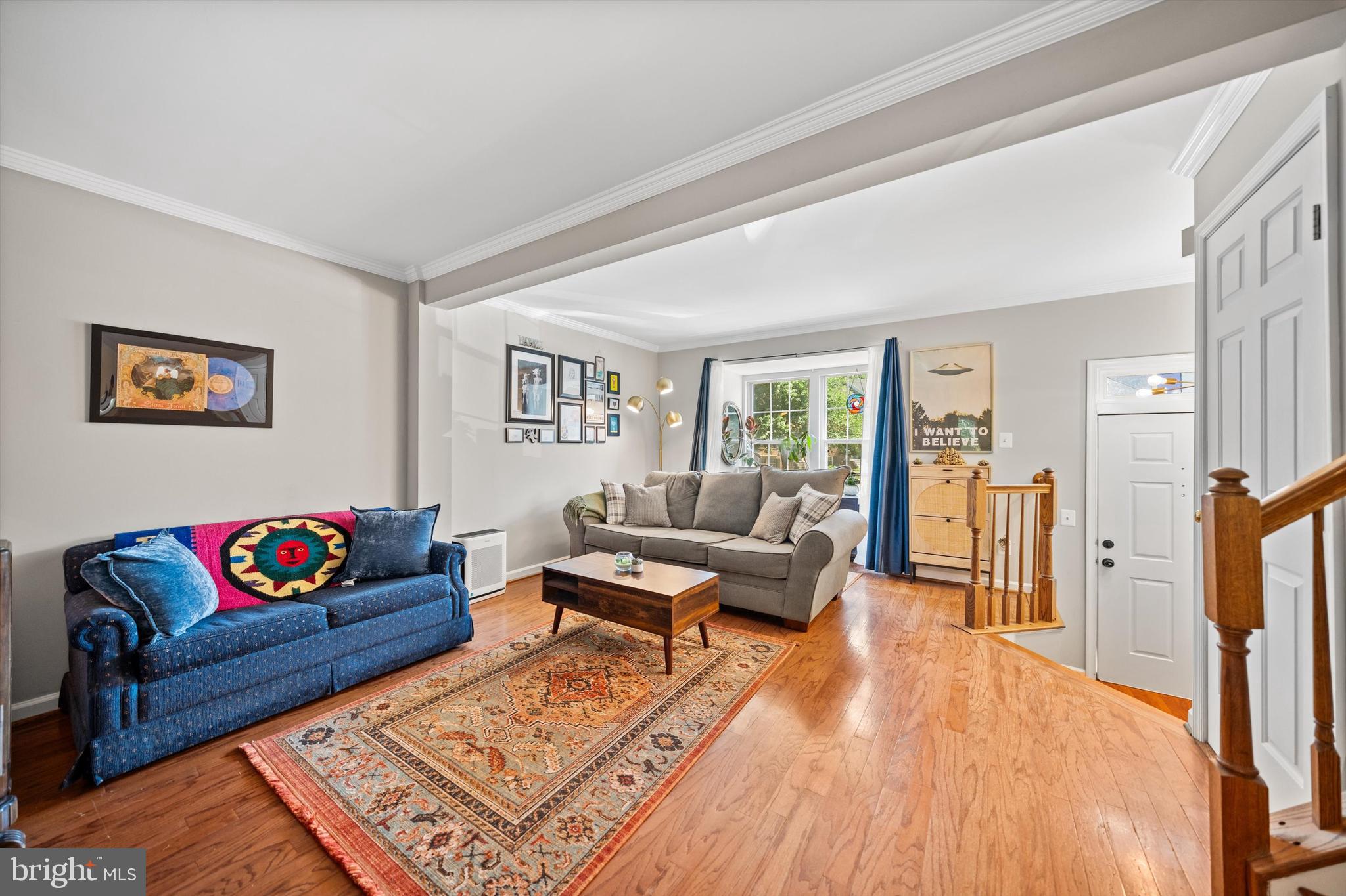 12794 Silvia Loop Woodbridge, VA 22192 - Photo 4 of 24 a living room with furniture a rug and a couch