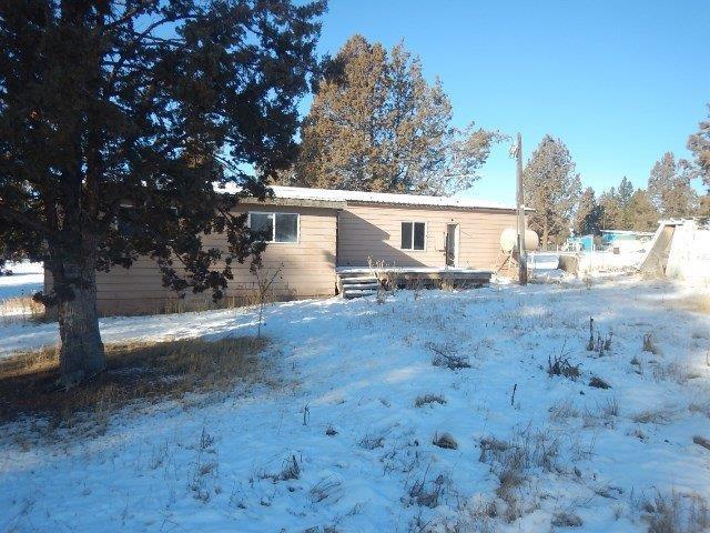 29947 Sprague River Road Chiloquin, OR 97624 - Photo 12 of 12 a view of a yard with plants and a tree