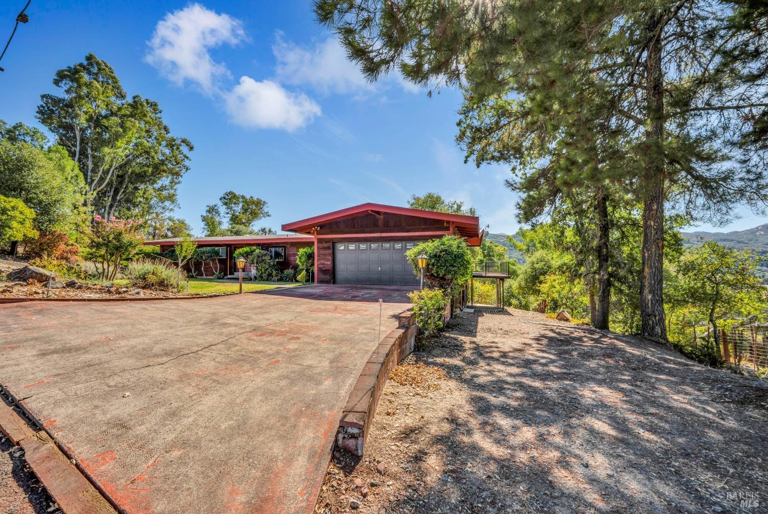 571 Riverside Drive Ukiah, CA 95482 - Photo 1 of 1 a yellow house with trees in front of it