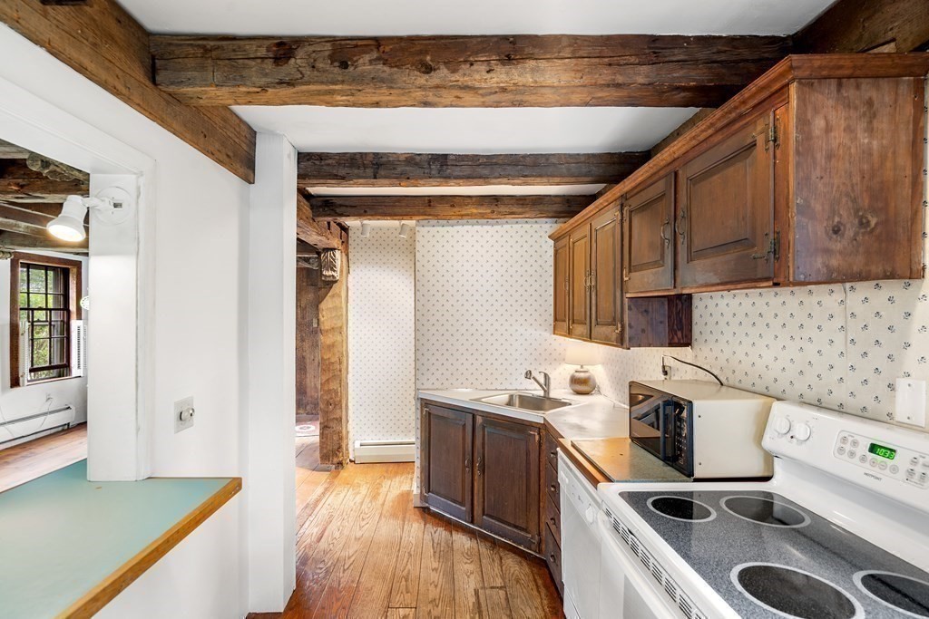 1 Red Frank Lane Marblehead, MA 01945 - Photo 19 of 32 a kitchen with a stove a sink and a refrigerator