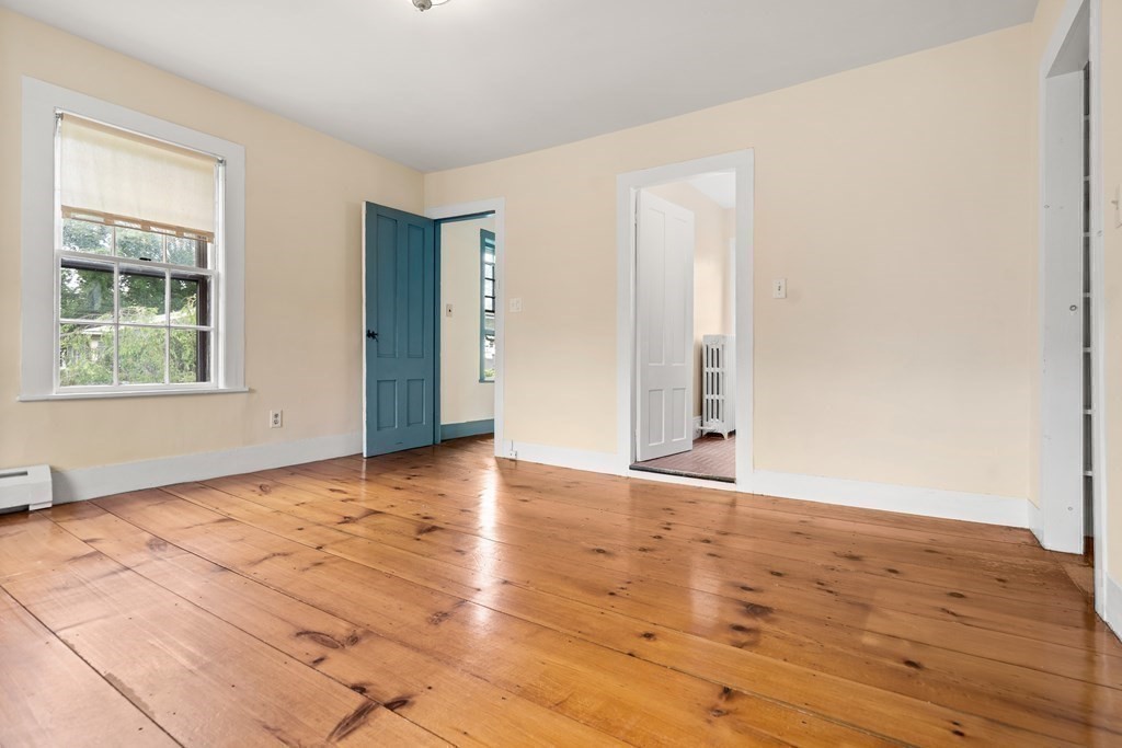 1 Red Frank Lane Marblehead, MA 01945 - Photo 26 of 32 a view of an empty room with wooden floor and a window