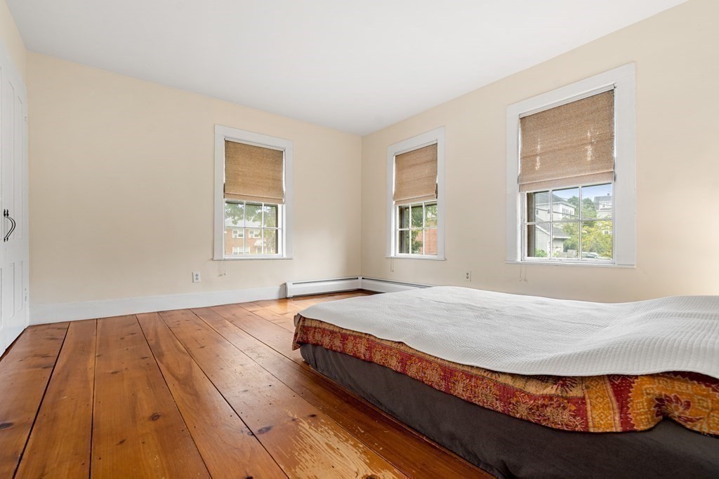1 Red Frank Lane Marblehead, MA 01945 - Photo 28 of 32 a bed sitting in a bedroom next to a window