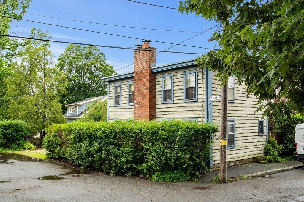 1 Red Frank Lane Marblehead, MA 01945 - Photo 5 of 32 a front view of a house with a yard