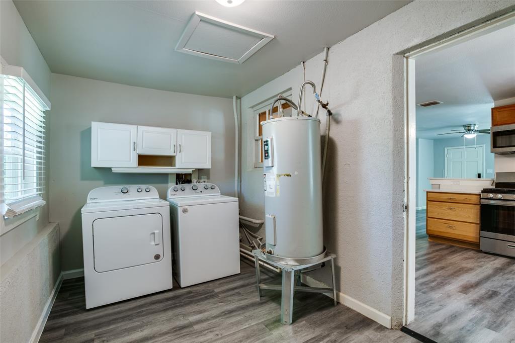 606 West High Street Terrell, TX 75160 - Photo 14 of 28 a view of kitchen with refrigerator and wooden floor