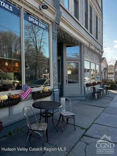 5359 Main Street, Unit 2H Windham, NY 12496 - Photo 17 of 22 a building outdoor space with patio furniture and potted plants