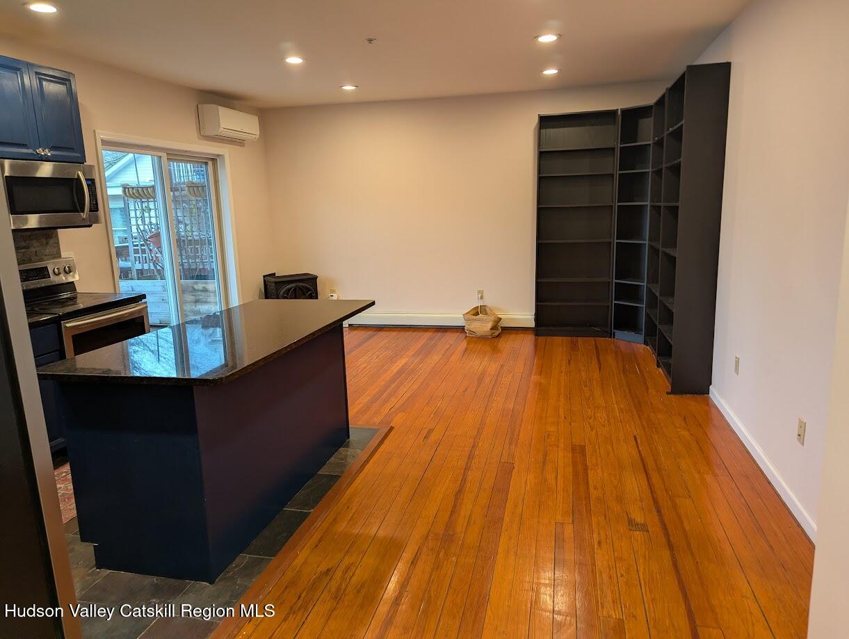 5359 Main Street, Unit 2H Windham, NY 12496 - Photo 5 of 22 a view of kitchen with cabinets and wooden floor