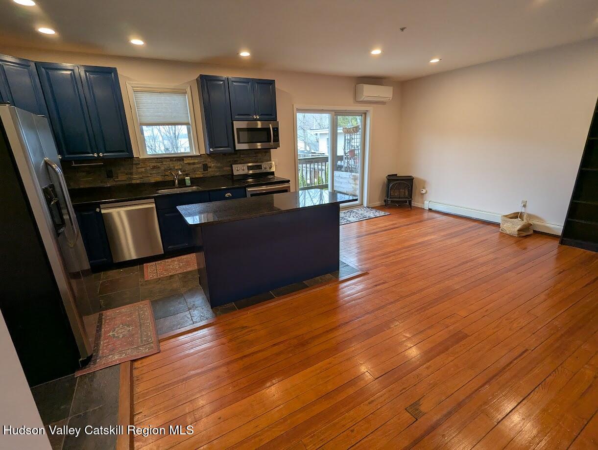 5359 Main Street, Unit 2H Windham, NY 12496 - Photo 6 of 22 a kitchen with stainless steel appliances a refrigerator and a stove top oven