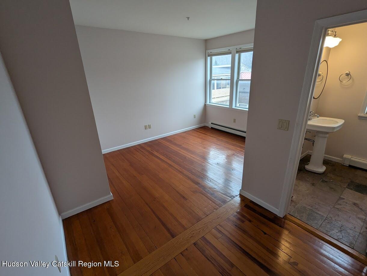 5359 Main Street, Unit 2H Windham, NY 12496 - Photo 9 of 22 a view of a room with wooden floor and staircase