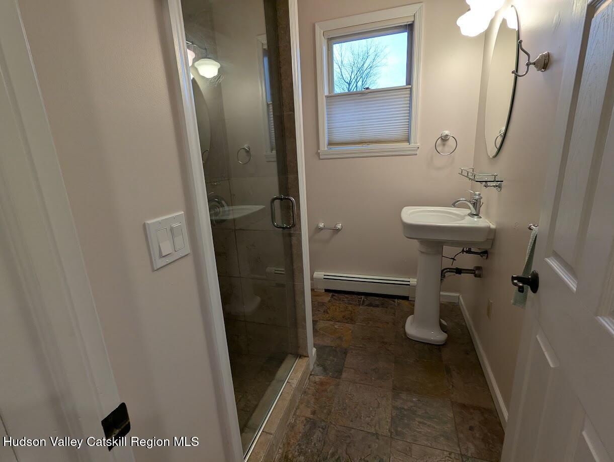 5359 Main Street, Unit 2H Windham, NY 12496 - Photo 10 of 22 a bathroom with a sink and mirror