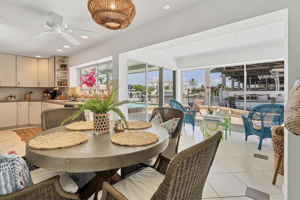 161 Damficare Street Boca Grande, FL 33921 - Photo 17 of 51 a view of a dining room with furniture and chandelier