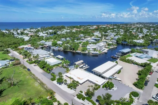 an aerial view of a house with a lake view