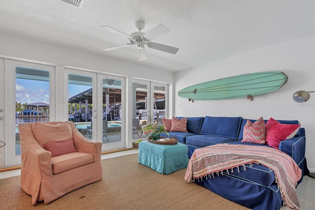 161 Damficare Street Boca Grande, FL 33921 - Photo 21 of 51 a living room with furniture and a large window