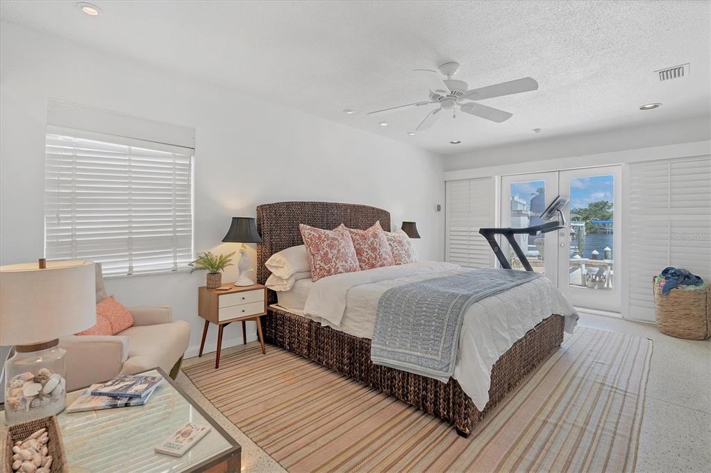 161 Damficare Street Boca Grande, FL 33921 - Photo 23 of 51 a bedroom with a bed and wooden floor