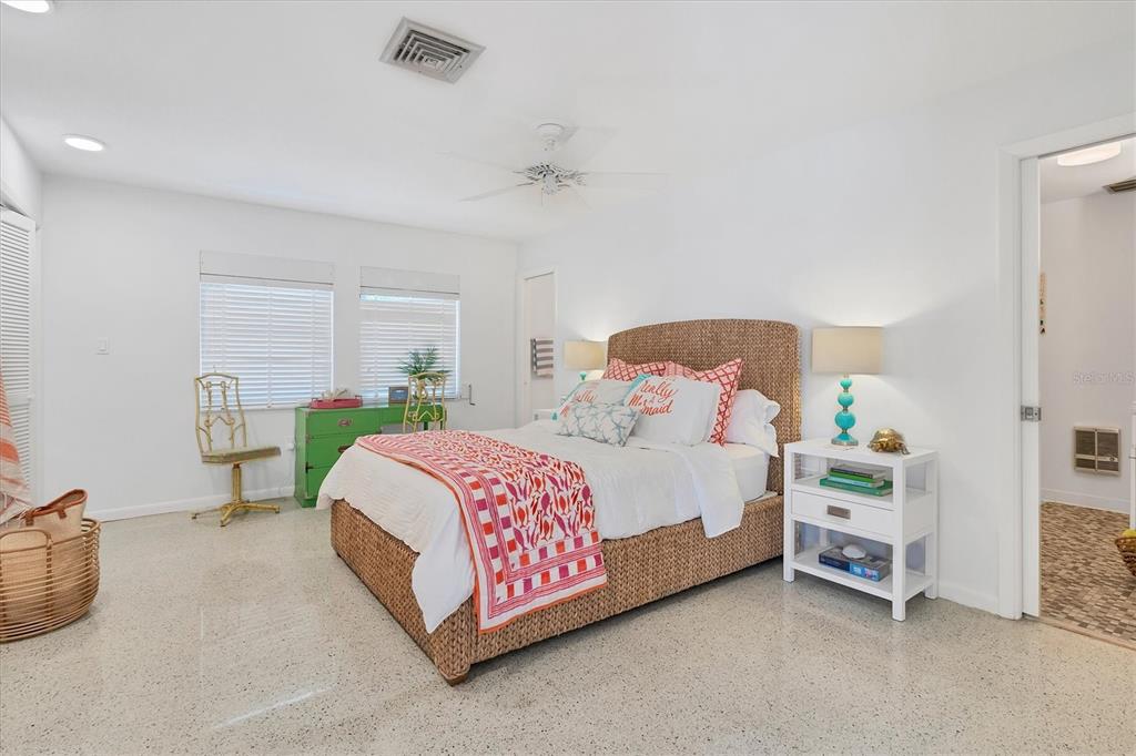 161 Damficare Street Boca Grande, FL 33921 - Photo 31 of 51 a bedroom with a bed and a window