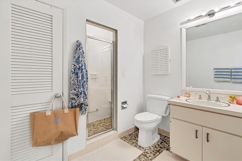 161 Damficare Street Boca Grande, FL 33921 - Photo 33 of 51 a bathroom with a sink toilet and shower