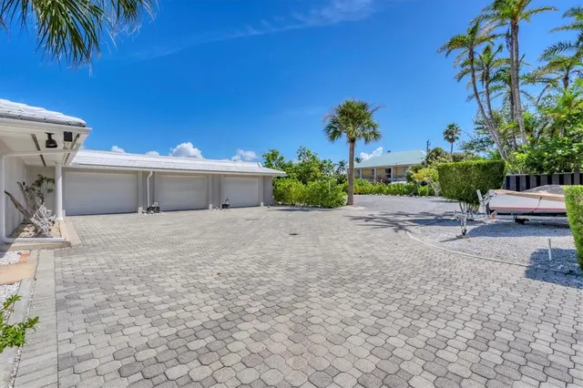 a front view of a house with a yard and a garage