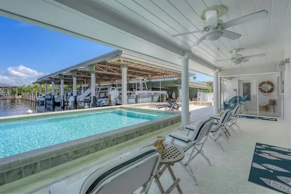 a view of a chairs and table in patio