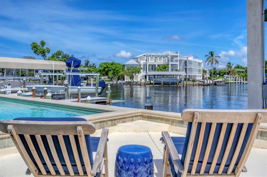 161 Damficare Street Boca Grande, FL 33921 - Photo 40 of 51 a terrace with outdoor seating and city view