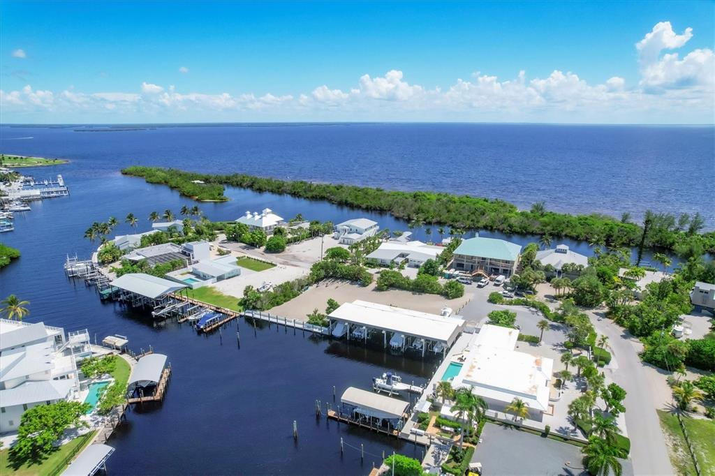161 Damficare Street Boca Grande, FL 33921 - Photo 4 of 51 an aerial view of a house with a yard basket ball court and outdoor seating