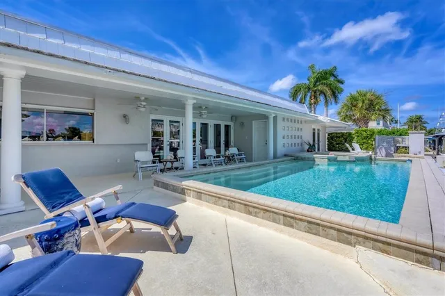 a view of a house with backyard and porch