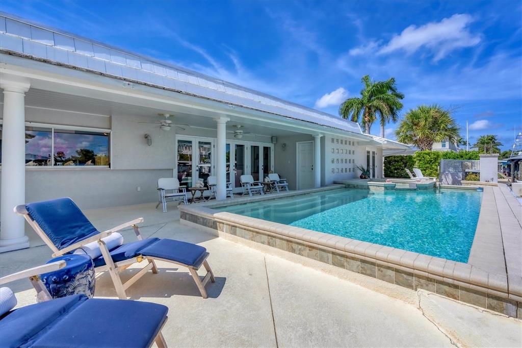 161 Damficare Street Boca Grande, FL 33921 - Photo 41 of 51 a view of a house with backyard and porch