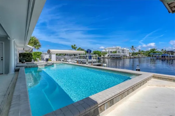 a view of a swimming pool with a patio