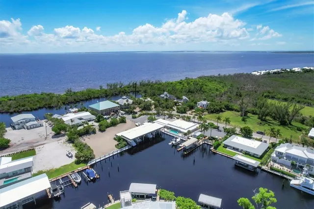 an aerial view of a houses with yard