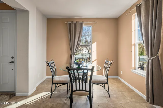 a view of a dining room with furniture window and outside view