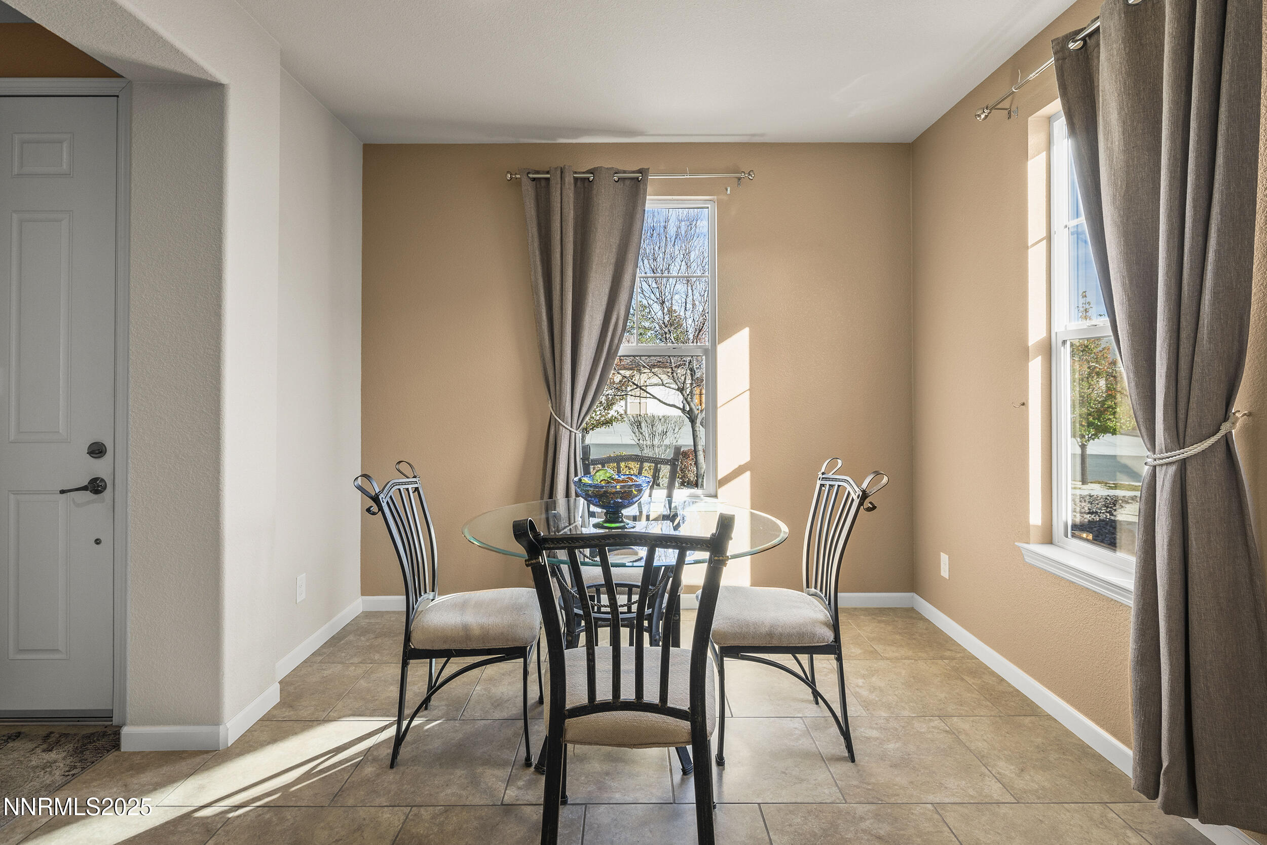 9165 Kenton Trail Reno, NV 89523 - Photo 13 of 22 a view of a dining room with furniture window and outside view